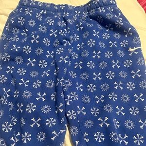 Royal blue Nike men’s sweettpants with snowflakes and cuffed ankles